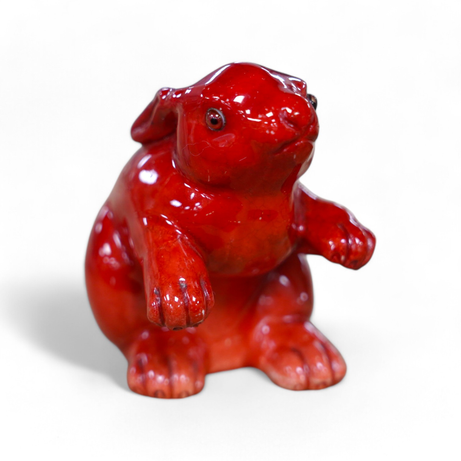 A Bernard Moore flambé rabbit, c.1910, inset orange glass eyes, 8cm high. Condition - good